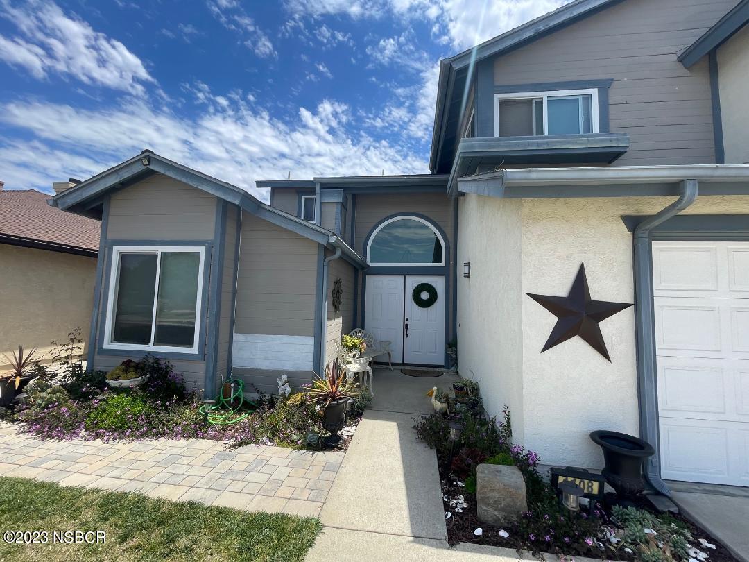 1108 Honeysuckle Way Lompoc, CA 93436 - Photo 3 of 54 a front view of a house with a yard