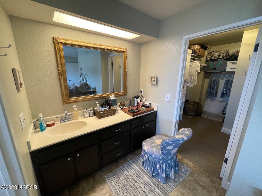 1108 Honeysuckle Way Lompoc, CA 93436 - Photo 31 of 54 a bathroom with a sink mirror and a toilet