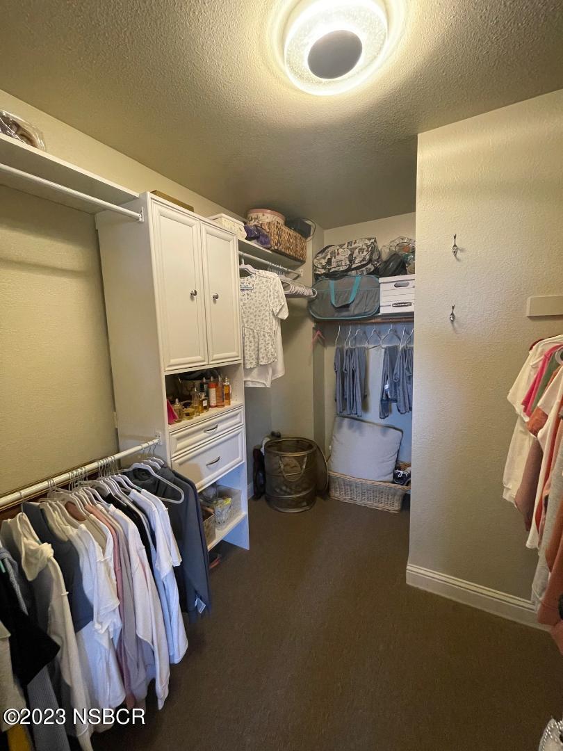 1108 Honeysuckle Way Lompoc, CA 93436 - Photo 32 of 54 a bedroom with a bed and a chair