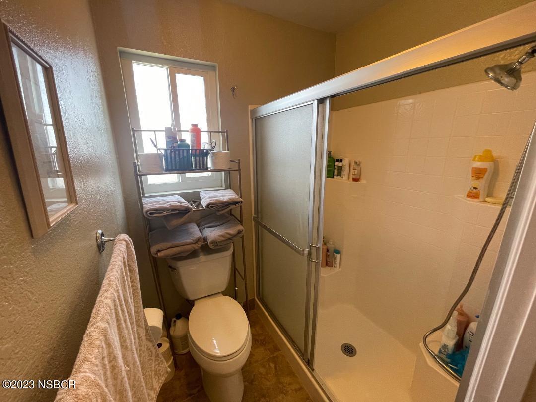 1108 Honeysuckle Way Lompoc, CA 93436 - Photo 33 of 54 a bathroom with a toilet and a shower