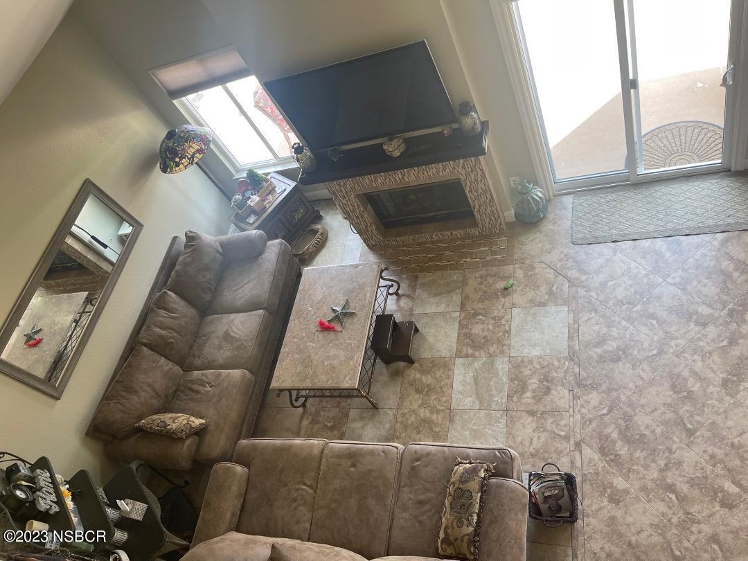 1108 Honeysuckle Way Lompoc, CA 93436 - Photo 36 of 54 a living room with furniture and a floor to ceiling window