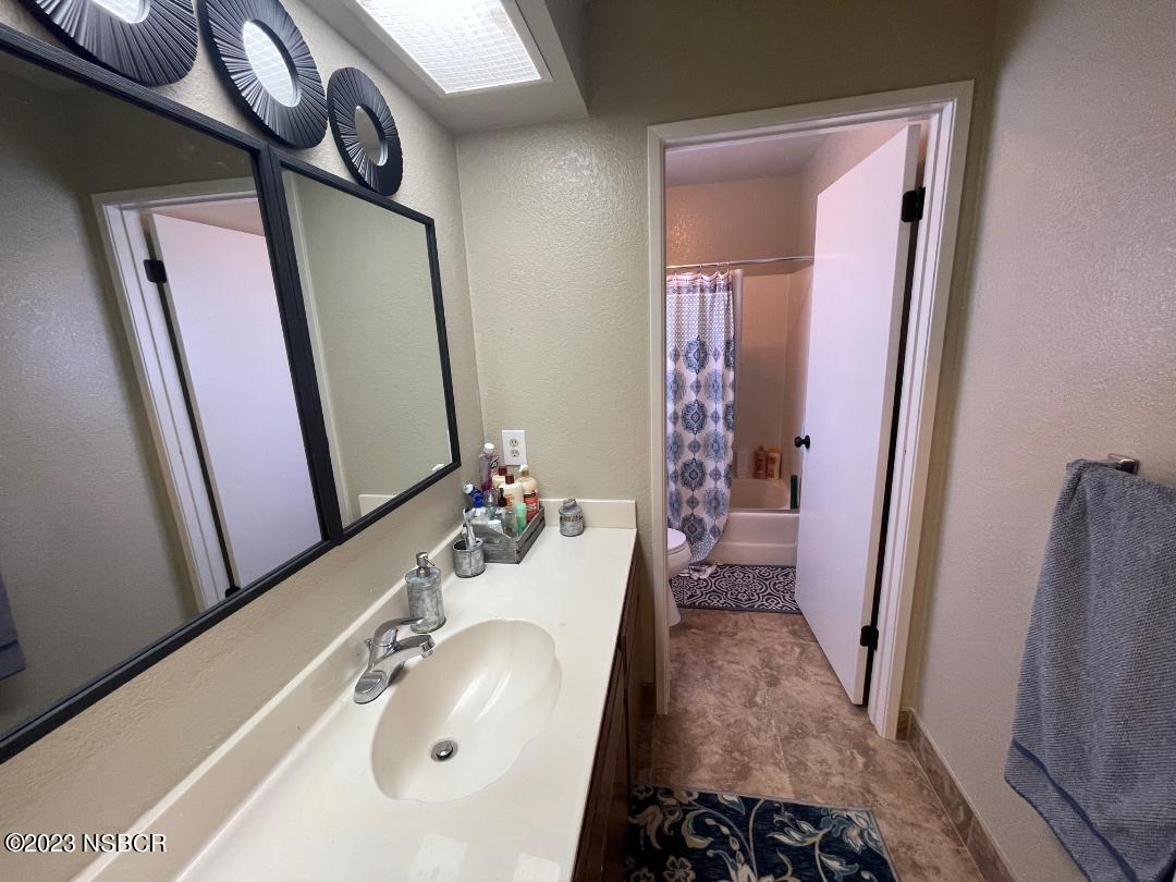 1108 Honeysuckle Way Lompoc, CA 93436 - Photo 37 of 54 a bathroom with a sink and a mirror