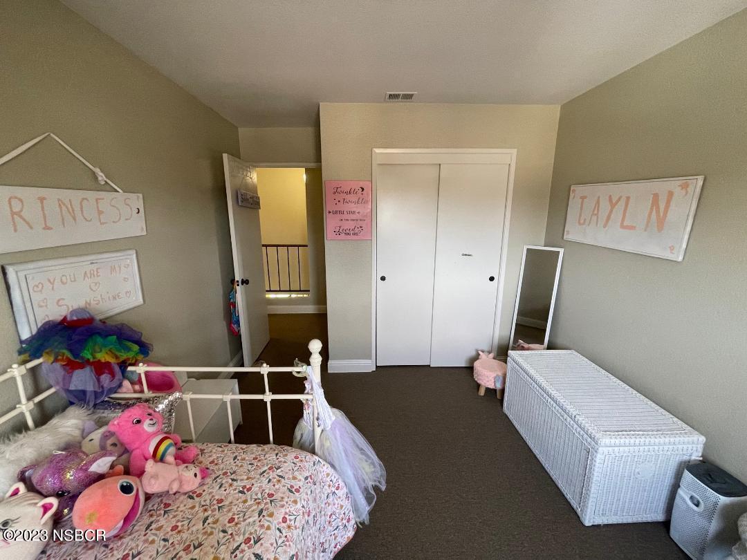 1108 Honeysuckle Way Lompoc, CA 93436 - Photo 44 of 54 a bedroom with furniture and a baby crib