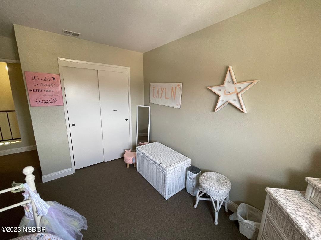 1108 Honeysuckle Way Lompoc, CA 93436 - Photo 45 of 54 a bedroom with a bed and a couch