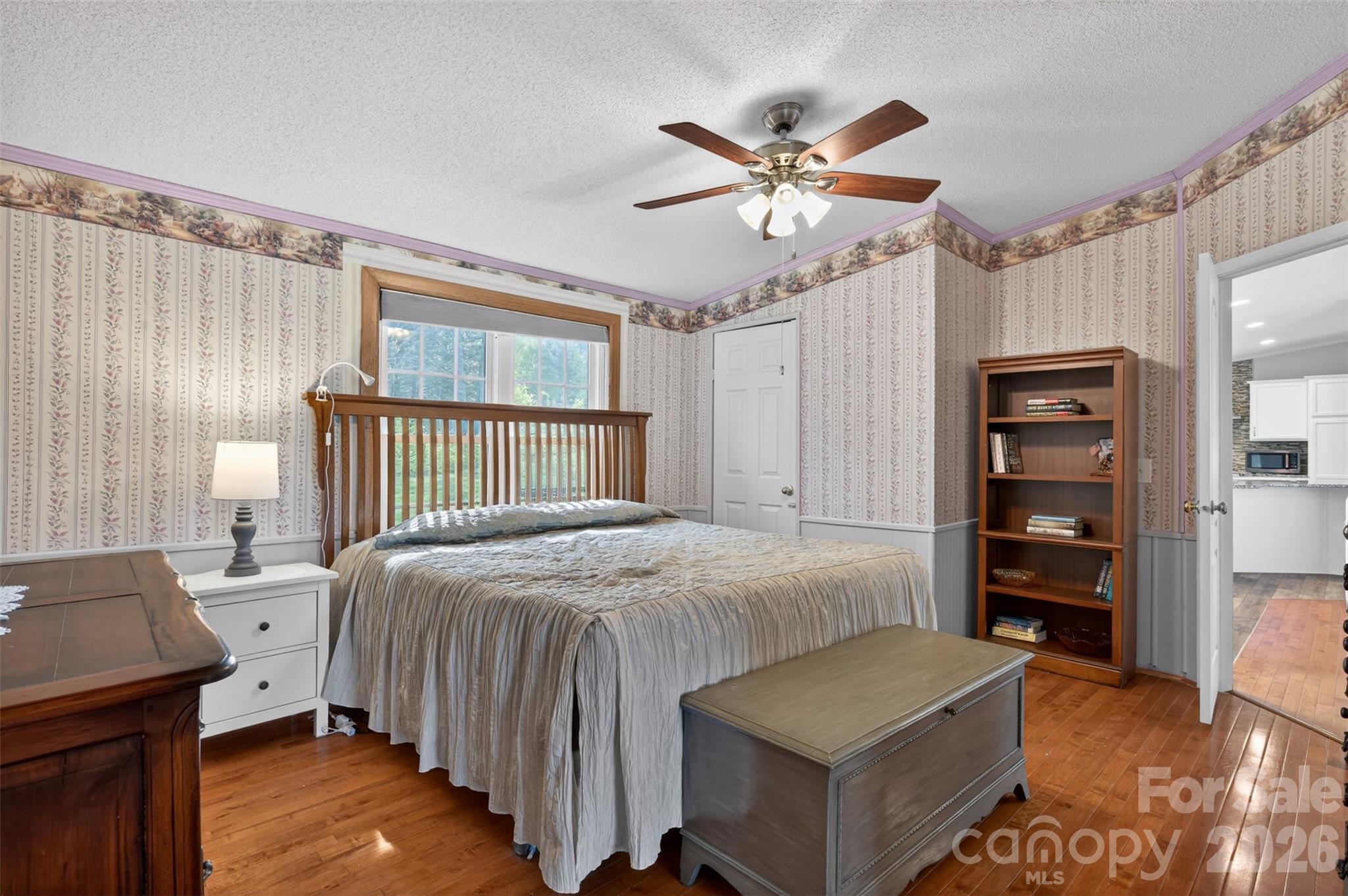 4352 Anderson Mountain Road Maiden, NC 28650 - Photo 19 of 42 a bedroom with a bed and a chandelier