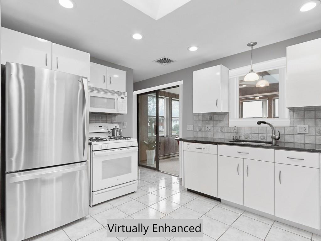 66 Anthony Road Newton, MA 02460 - Photo 12 of 39 a kitchen with stainless steel appliances a refrigerator sink and microwave