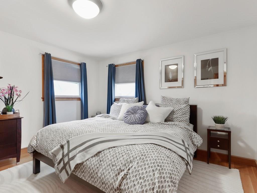 66 Anthony Road Newton, MA 02460 - Photo 17 of 39 a bedroom with a bed and a potted plant
