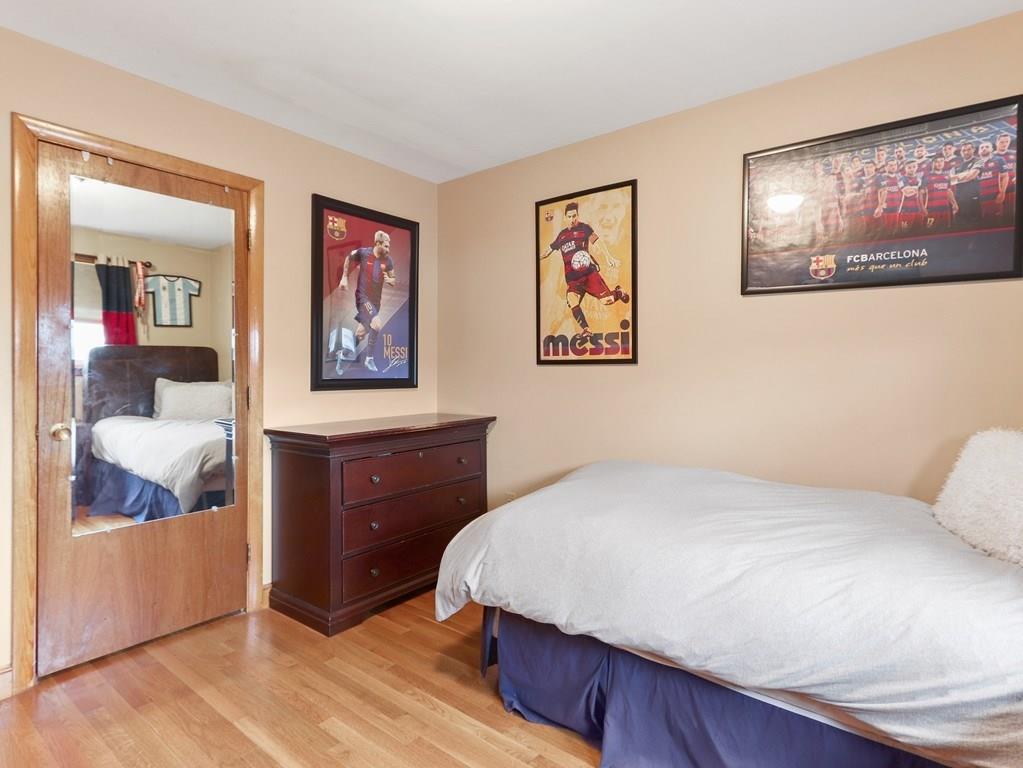 66 Anthony Road Newton, MA 02460 - Photo 20 of 39 a bedroom with a bed and painting on the wall