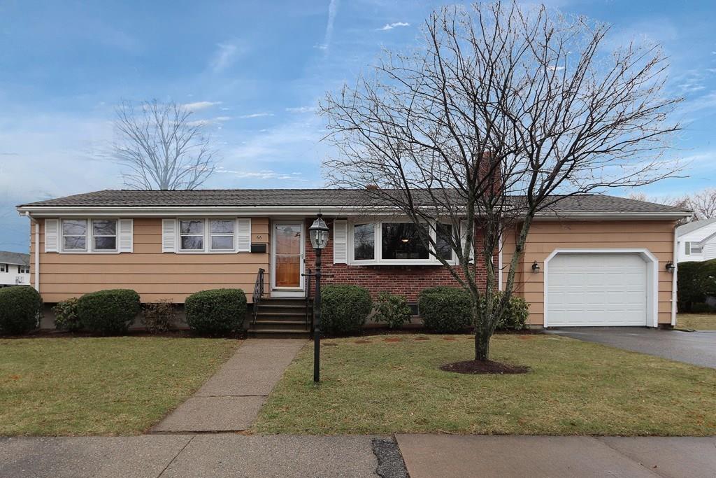 66 Anthony Road Newton, MA 02460 - Photo 2 of 39 a front view of a house with a yard and garage