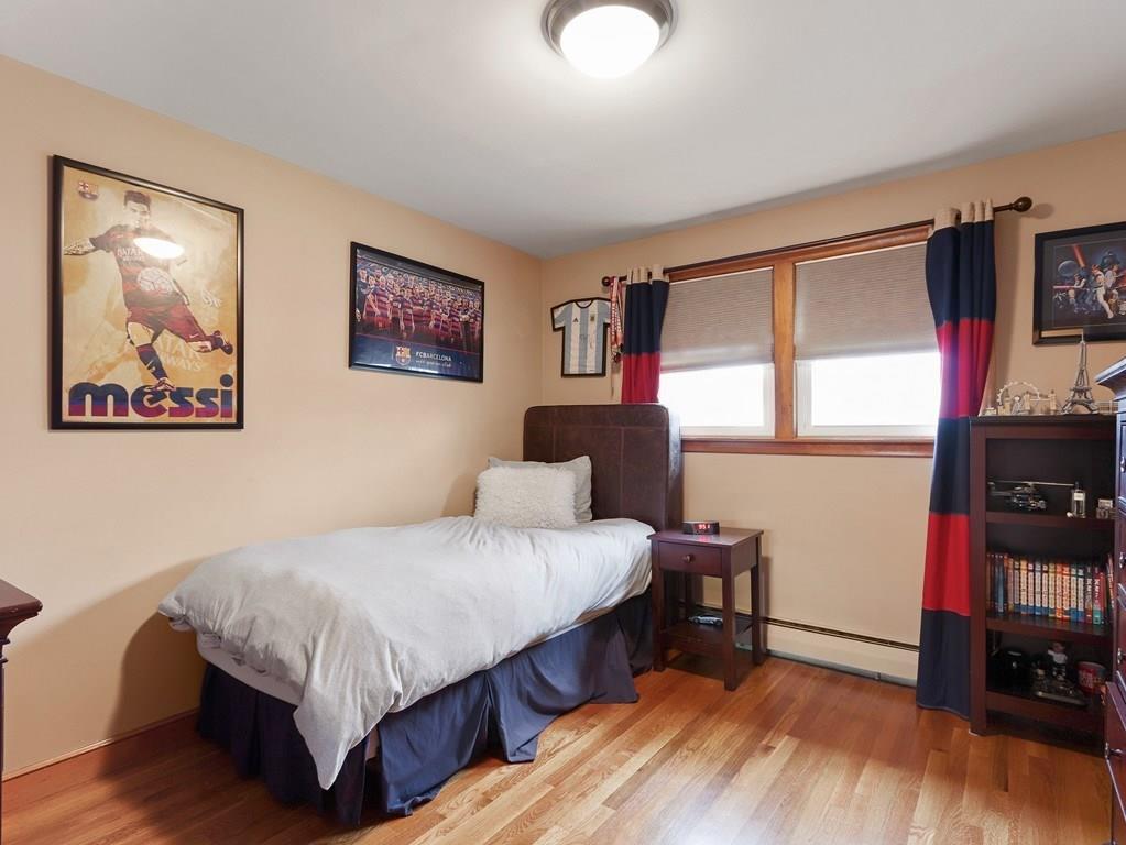 66 Anthony Road Newton, MA 02460 - Photo 21 of 39 a bedroom with a bed and a flat screen tv