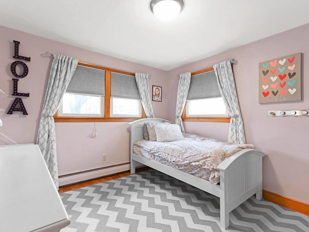 66 Anthony Road Newton, MA 02460 - Photo 22 of 39 a bedroom with a bed and a window