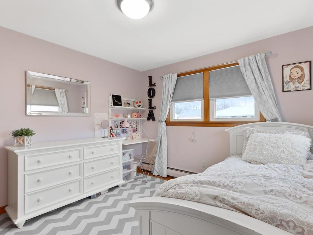 66 Anthony Road Newton, MA 02460 - Photo 23 of 39 a bedroom with a bed and a window