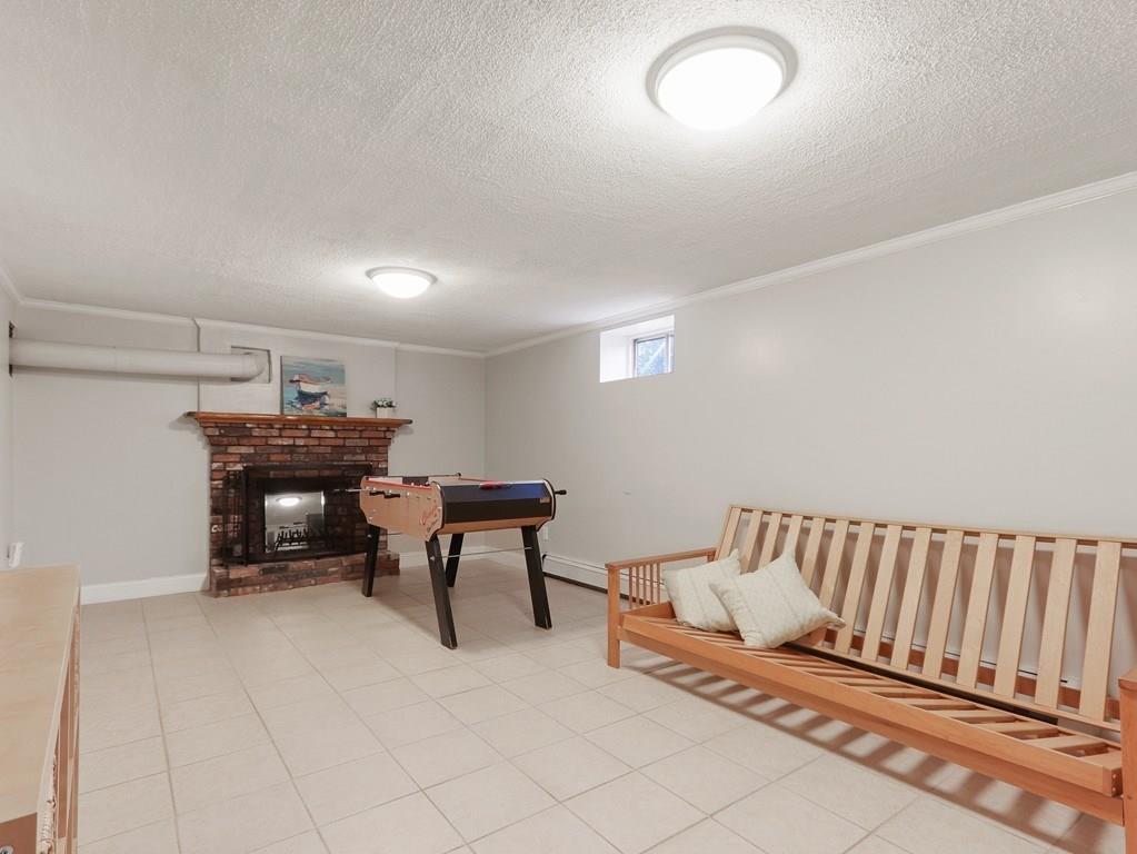 66 Anthony Road Newton, MA 02460 - Photo 28 of 39 a living room with furniture and a piano