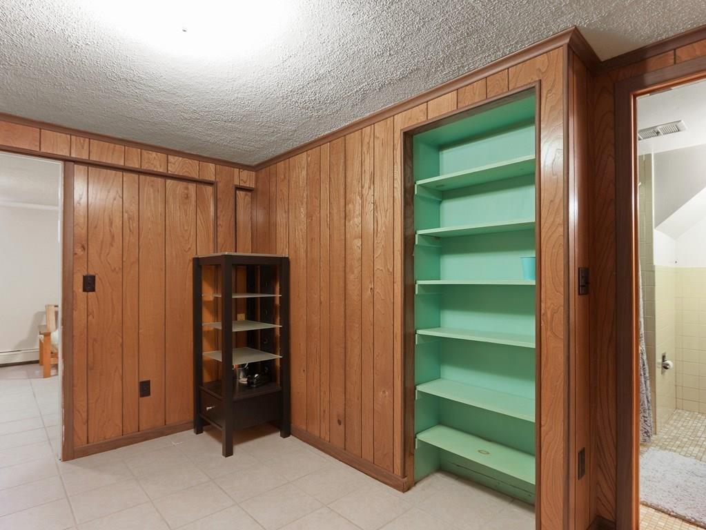 66 Anthony Road Newton, MA 02460 - Photo 32 of 39 a view of an empty room with a kitchen
