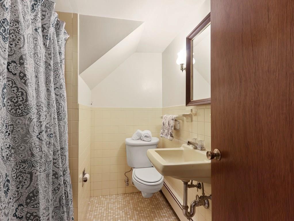 66 Anthony Road Newton, MA 02460 - Photo 35 of 39 a bathroom with a sink a toilet and mirror