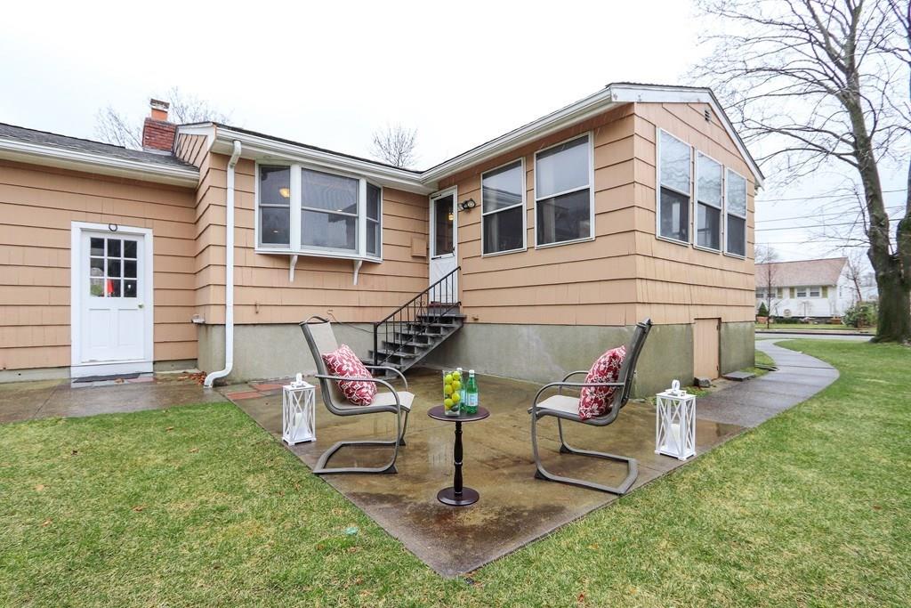 66 Anthony Road Newton, MA 02460 - Photo 37 of 39 a backyard of a house with seating space