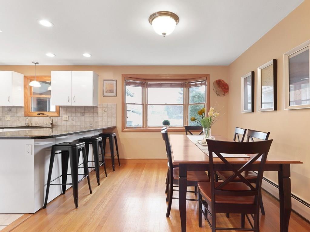 66 Anthony Road Newton, MA 02460 - Photo 8 of 39 a view of a dining room with furniture and wooden floor
