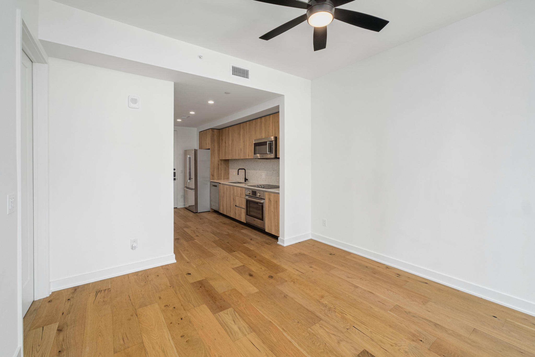 84 East Avenue, Unit 2008 Austin, TX 78701 - Photo 12 of 23 The kitchen blends well with the living area.