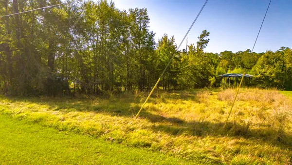 a view of yard with swimming pool