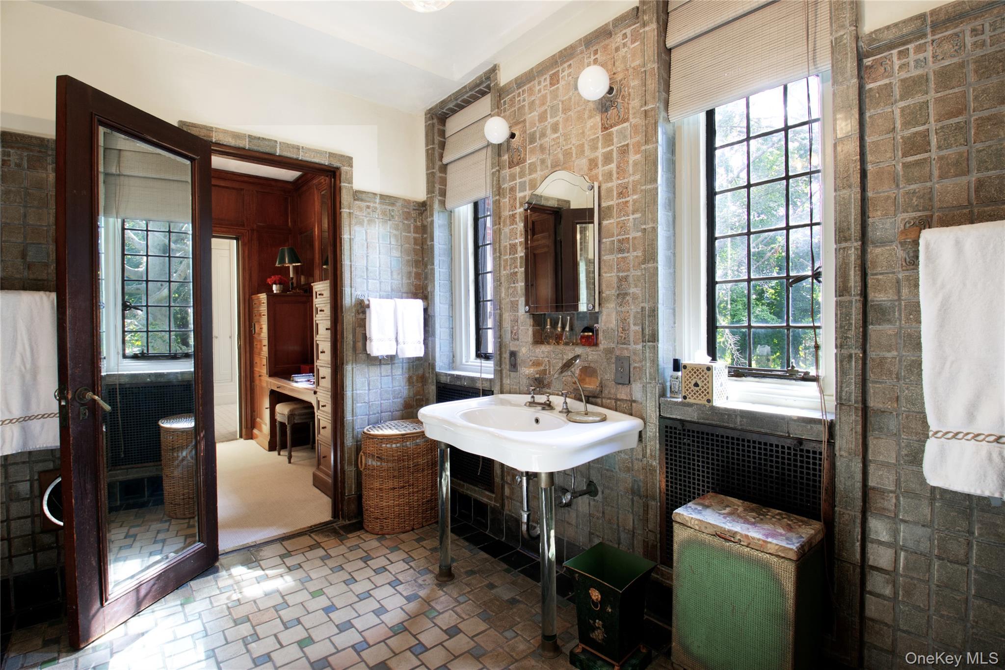 107 Bayview Road Manhasset, NY 11030 - Photo 21 of 40 a bathroom with a sink a toilet and tub