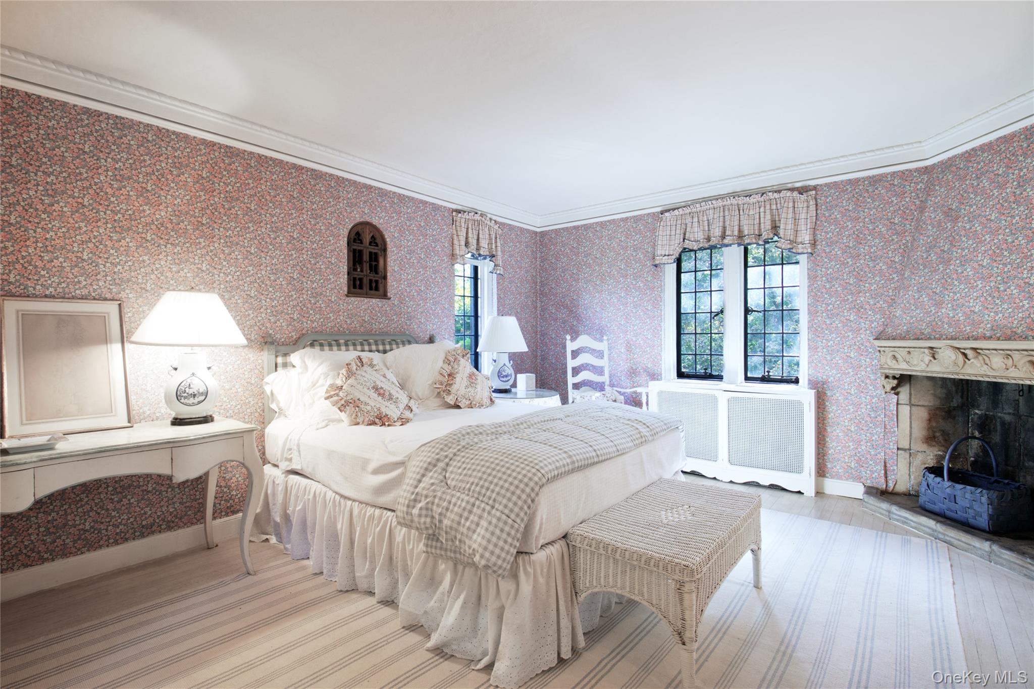 107 Bayview Road Manhasset, NY 11030 - Photo 28 of 40 a bedroom with a bed and a fireplace