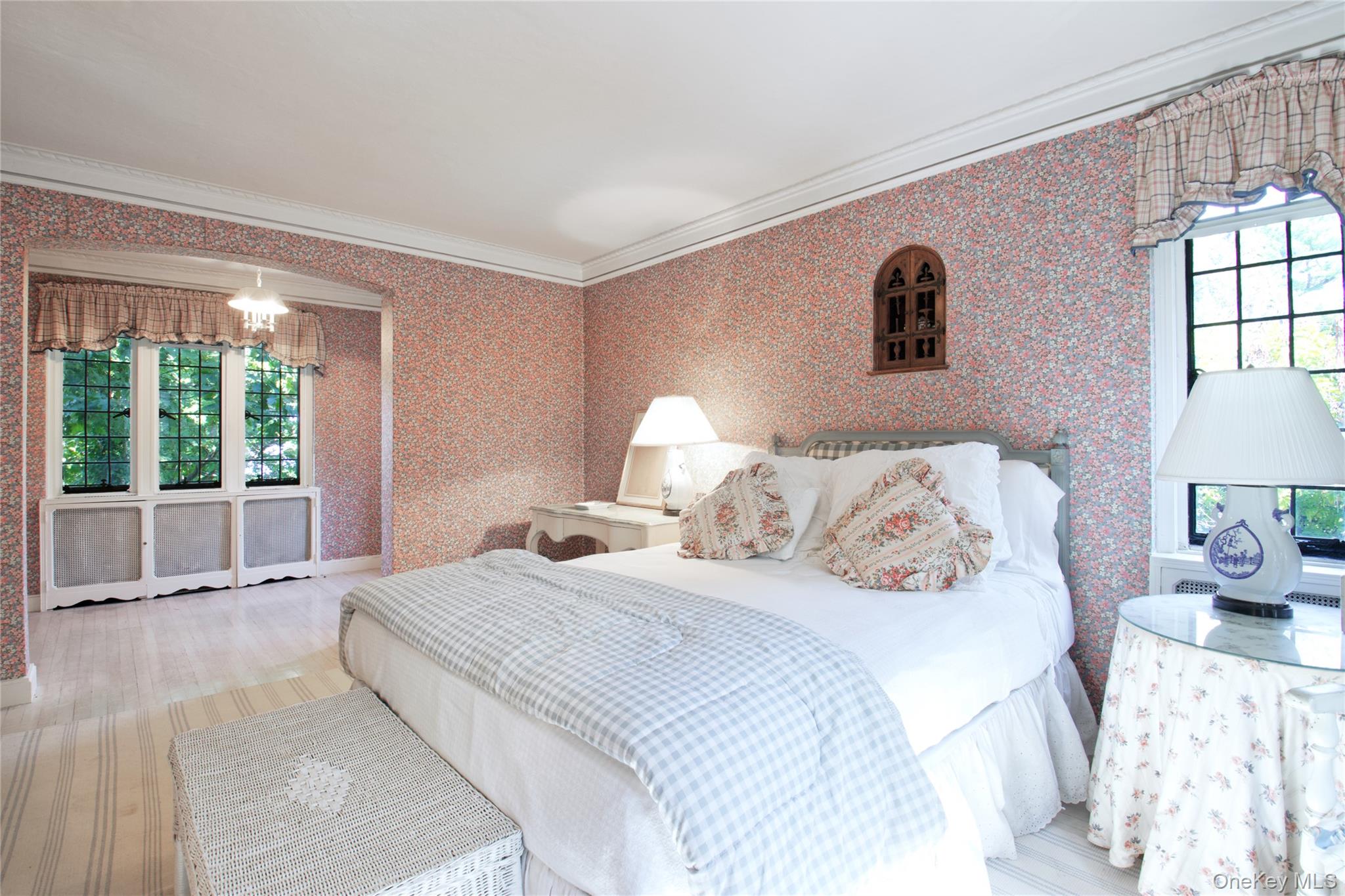 107 Bayview Road Manhasset, NY 11030 - Photo 29 of 40 a bedroom with a large bed and a large window with outer view