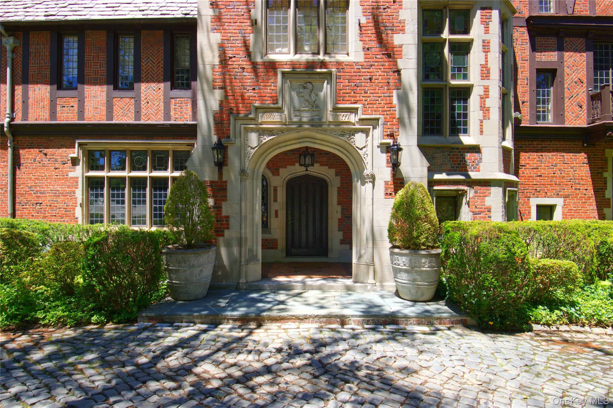107 Bayview Road Manhasset, NY 11030 - Photo 34 of 40 a view of building with a door and windows