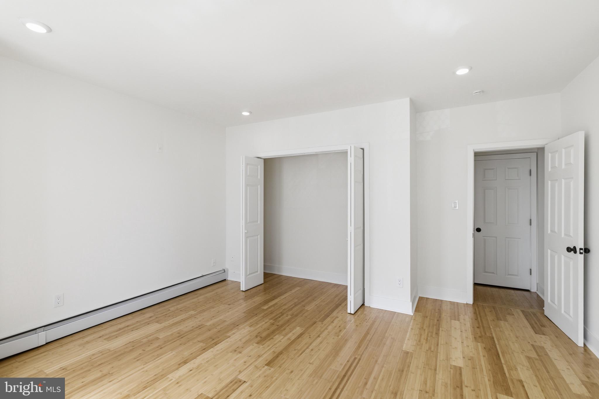 5939 Drexel Road, Unit CARRIAGE Philadelphia, PA 19131 - Photo 16 of 20 a view of an empty room and wooden floor
