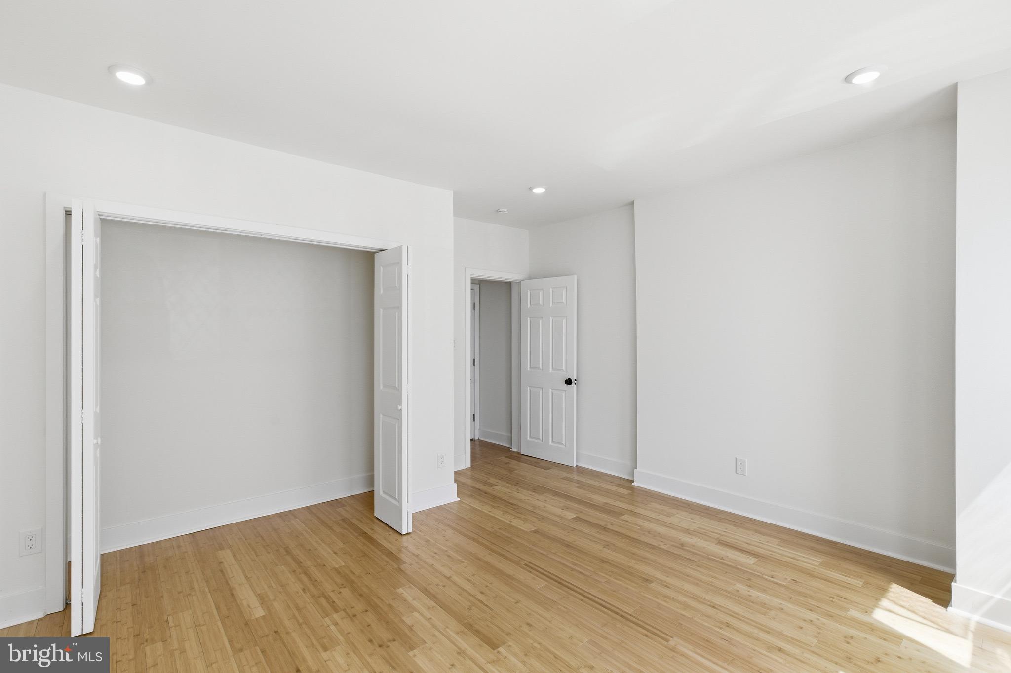 5939 Drexel Road, Unit CARRIAGE Philadelphia, PA 19131 - Photo 17 of 20 a view of an empty room with wooden floor and closet