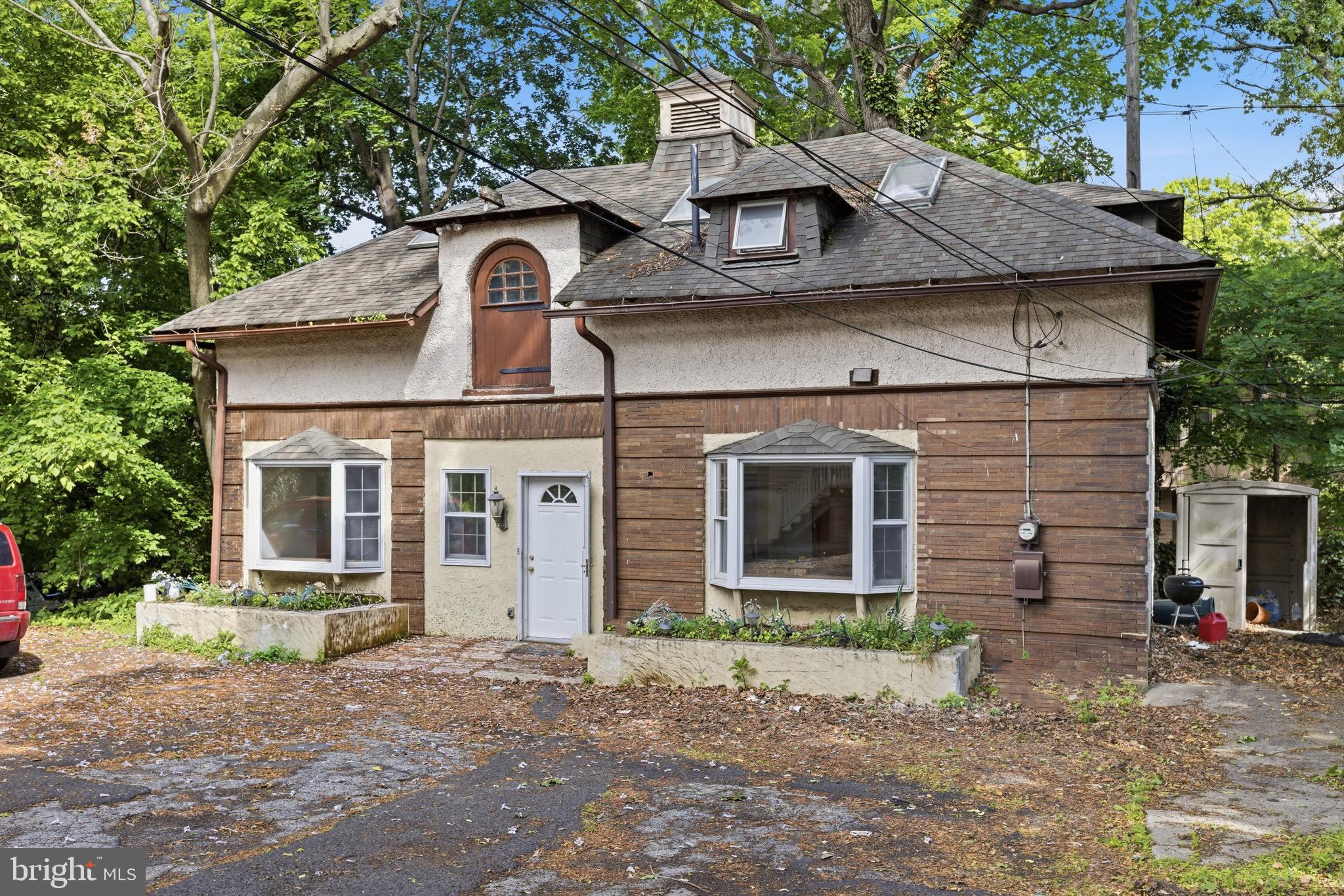 5939 Drexel Road, Unit CARRIAGE Philadelphia, PA 19131 - Photo 20 of 20 a front view of a house with garden