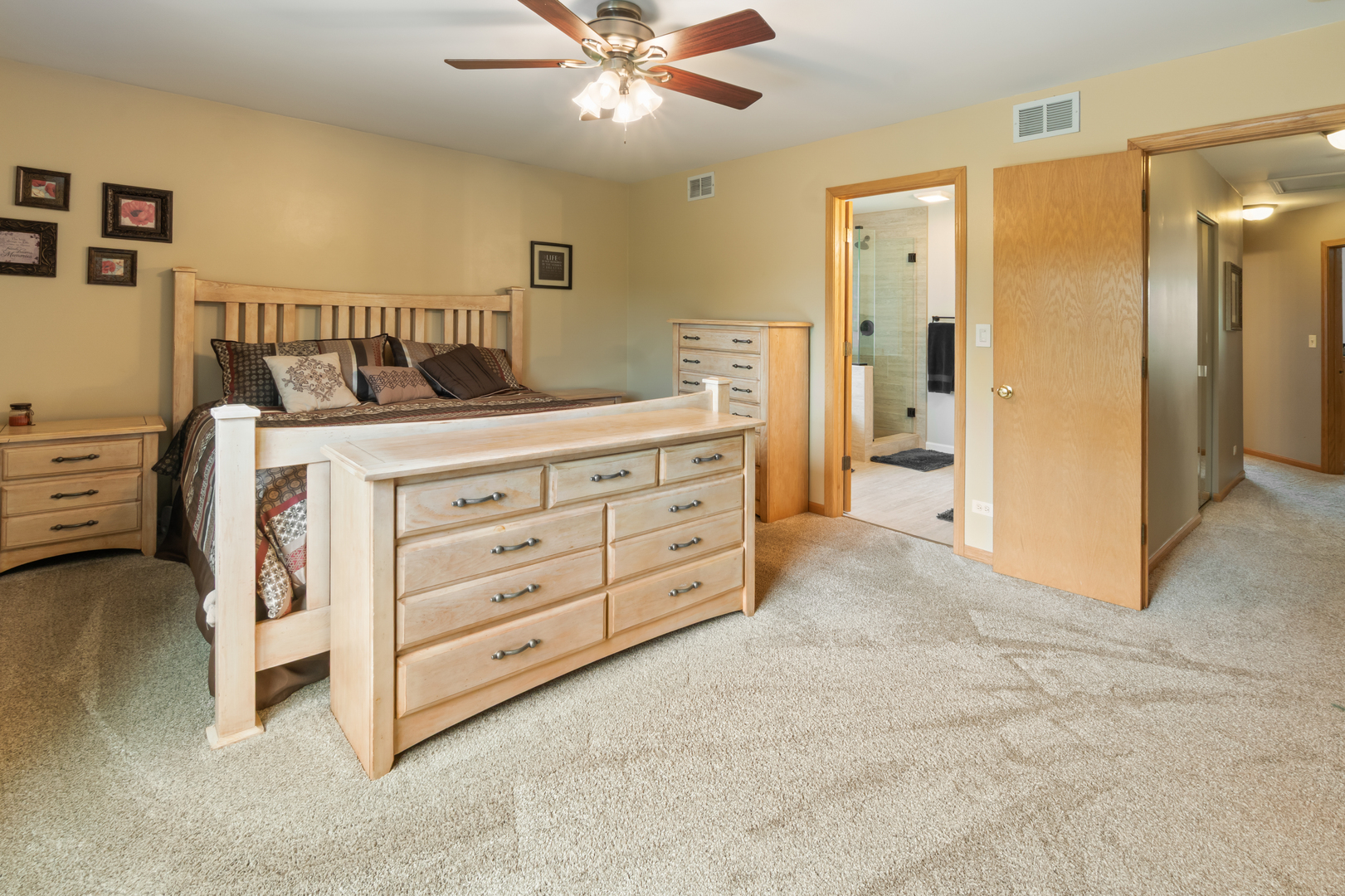 1985 Rochelle Court Wheeling, IL 60090 - Photo 10 of 38 a bedroom with a bed and a cabinets