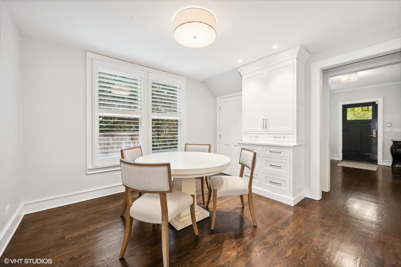786 Locust Street Winnetka, IL 60093 - Photo 13 of 46 a view of a dining room with furniture window and wooden floor