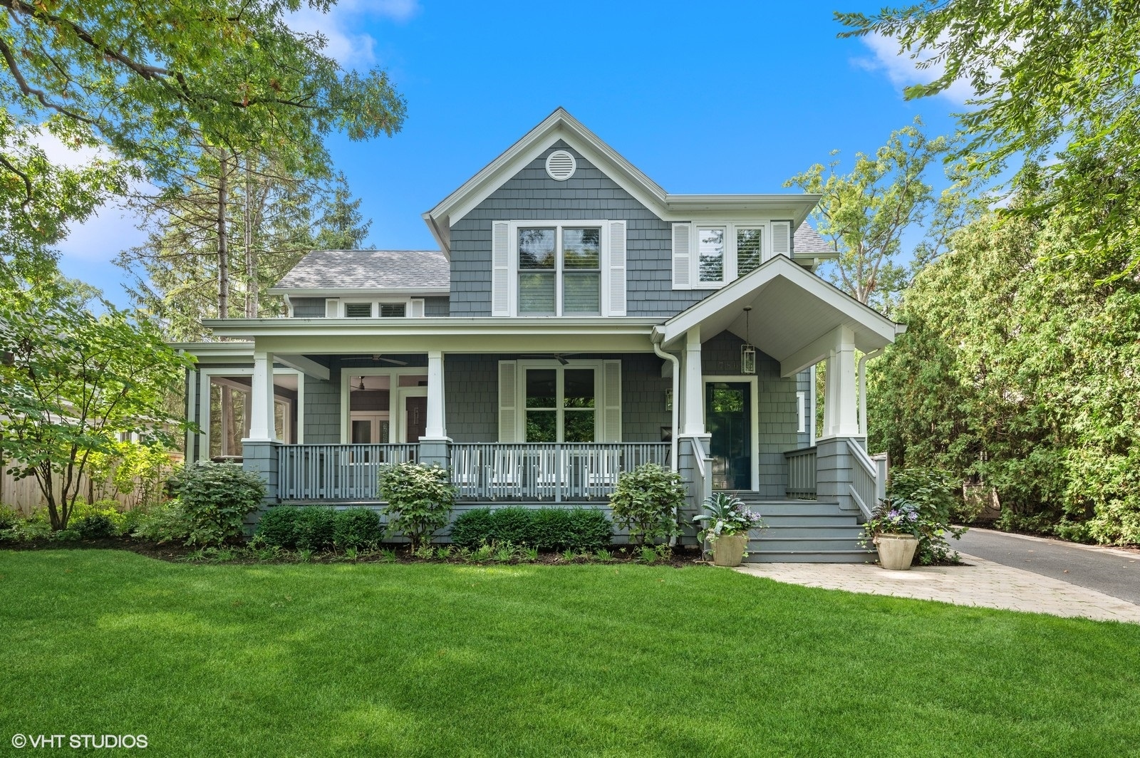 786 Locust Street Winnetka, IL 60093 - Photo 2 of 46 a front view of a house with a yard and trees