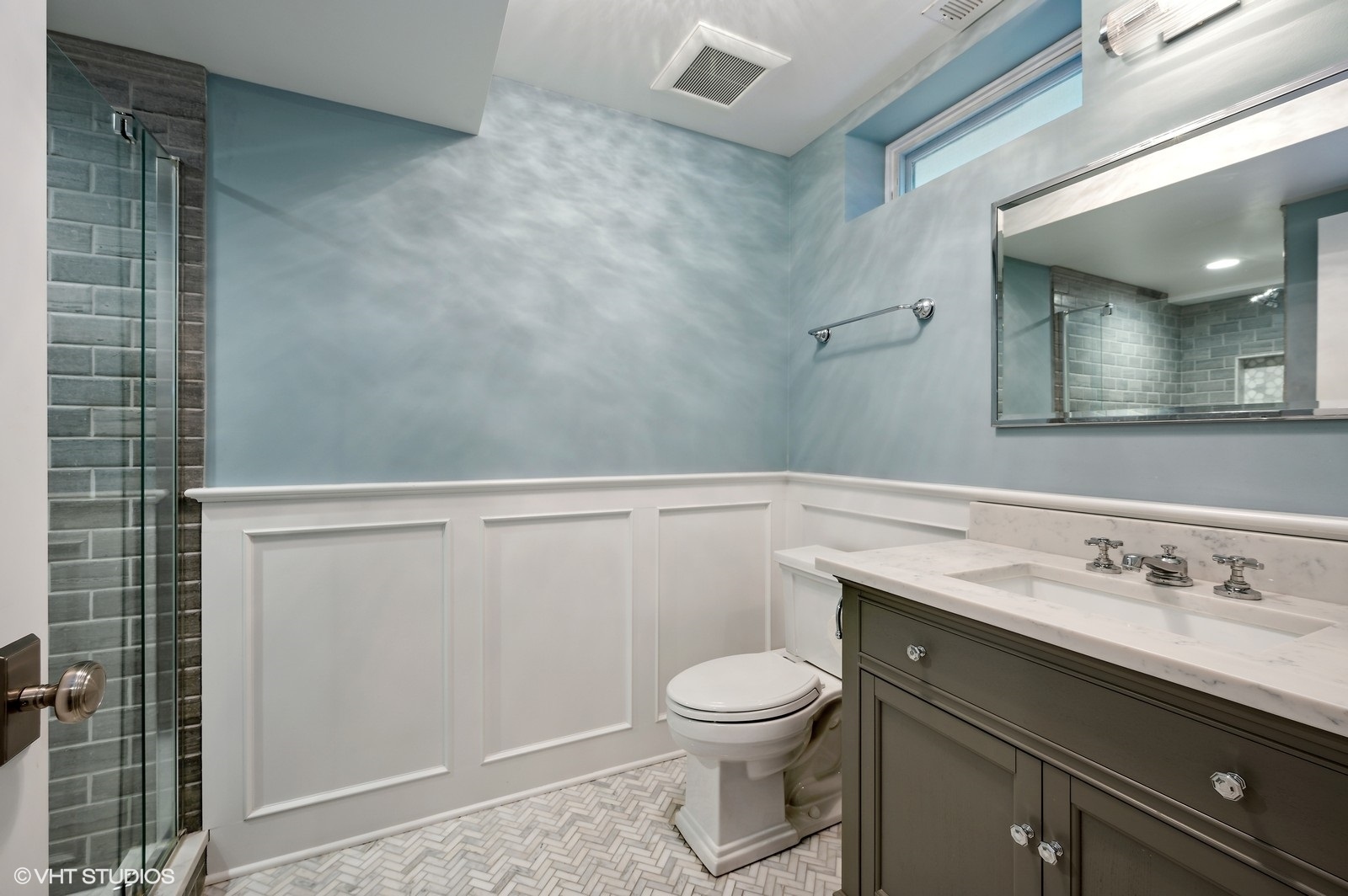 786 Locust Street Winnetka, IL 60093 - Photo 29 of 46 a bathroom with a sink a toilet and mirror