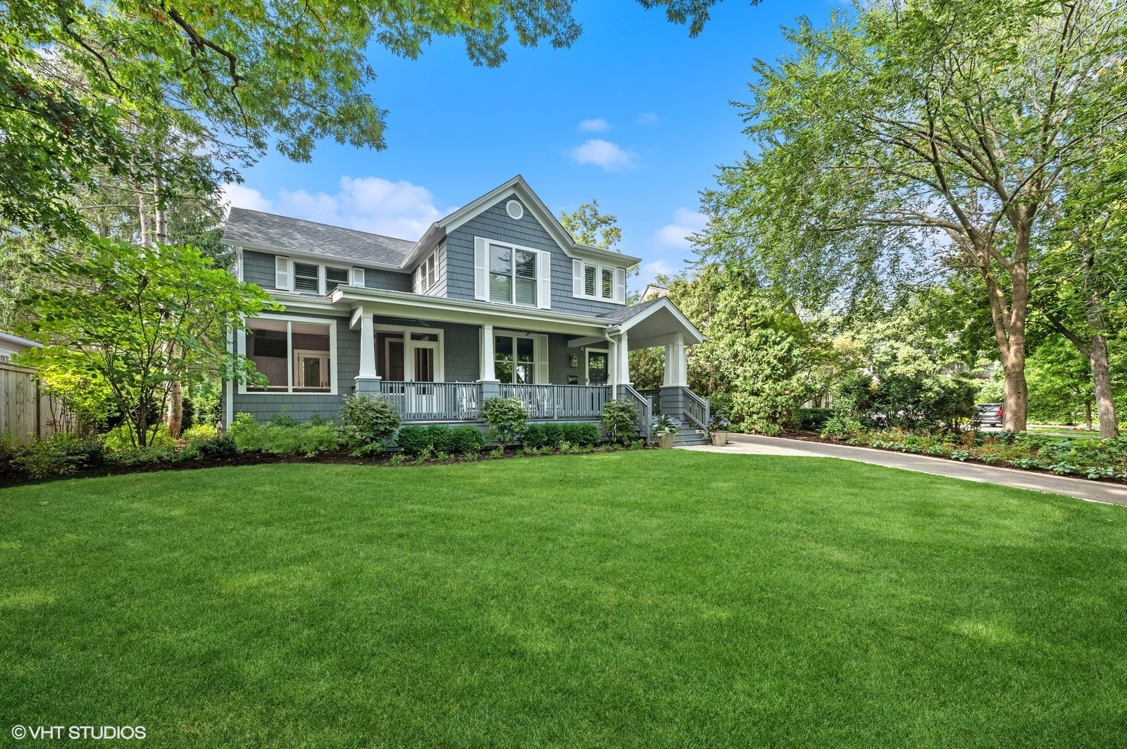 786 Locust Street Winnetka, IL 60093 - Photo 3 of 46 a front view of a house with a garden