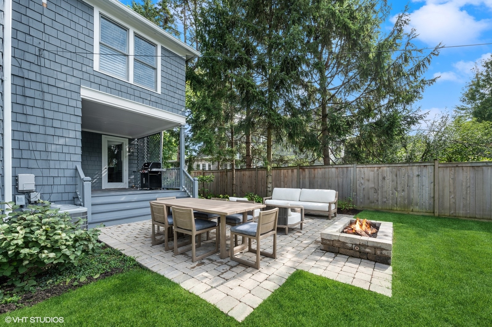 786 Locust Street Winnetka, IL 60093 - Photo 32 of 46 a view of a dinning table and chairs in the back yard of the house