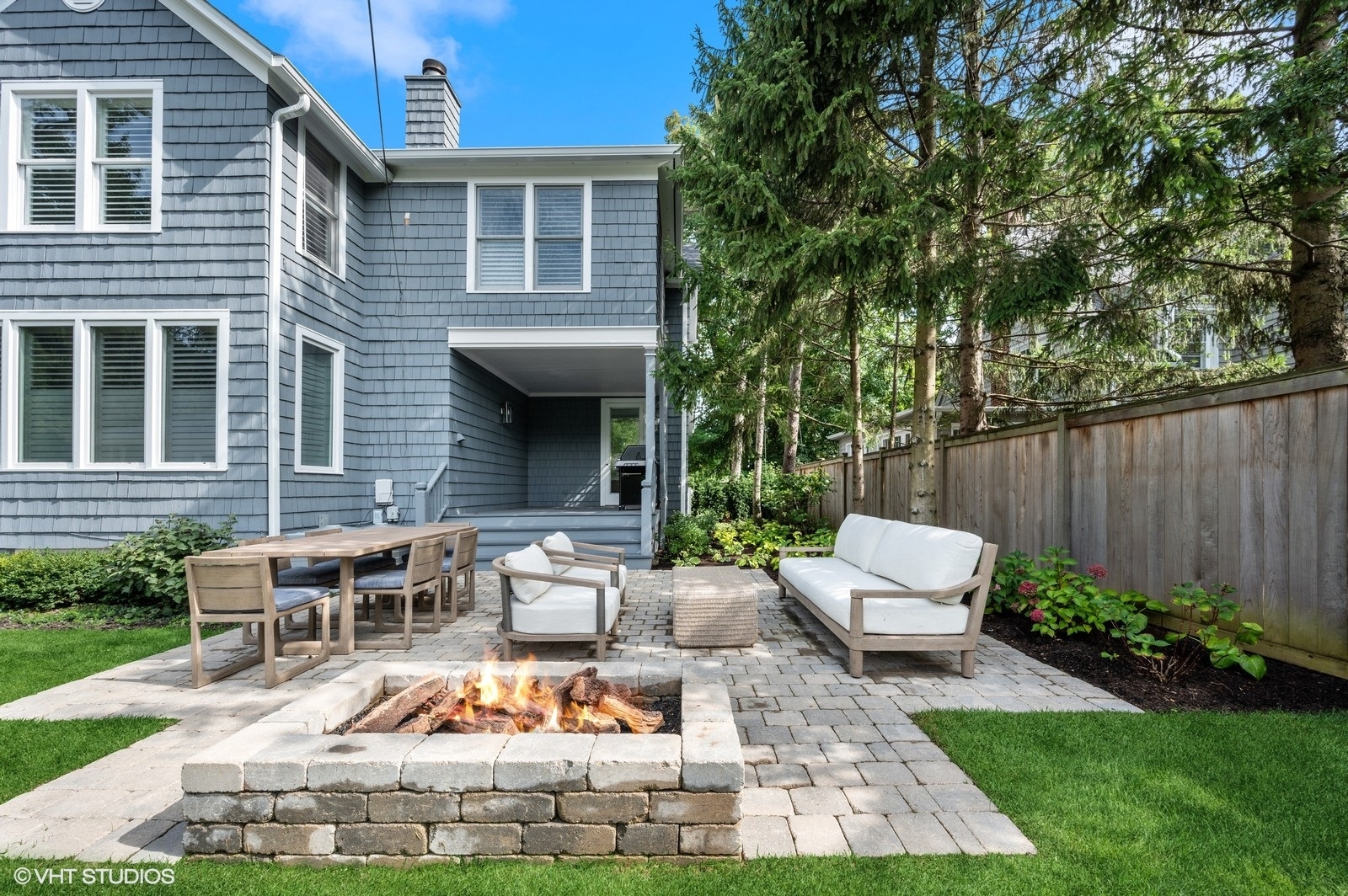 786 Locust Street Winnetka, IL 60093 - Photo 33 of 46 a view of a house with backyard sitting area and garden