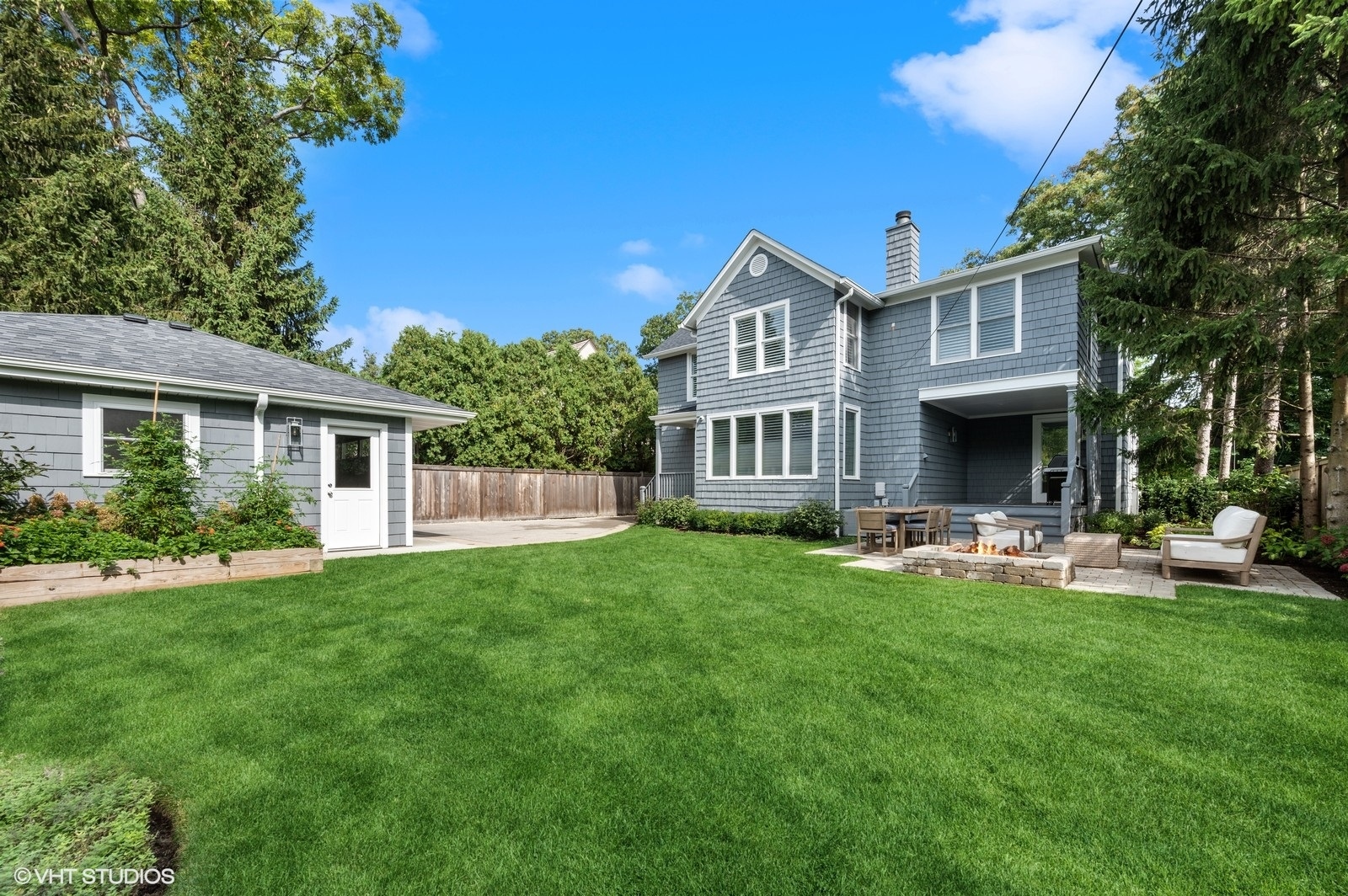 786 Locust Street Winnetka, IL 60093 - Photo 37 of 46 a front view of a house with patio and garden