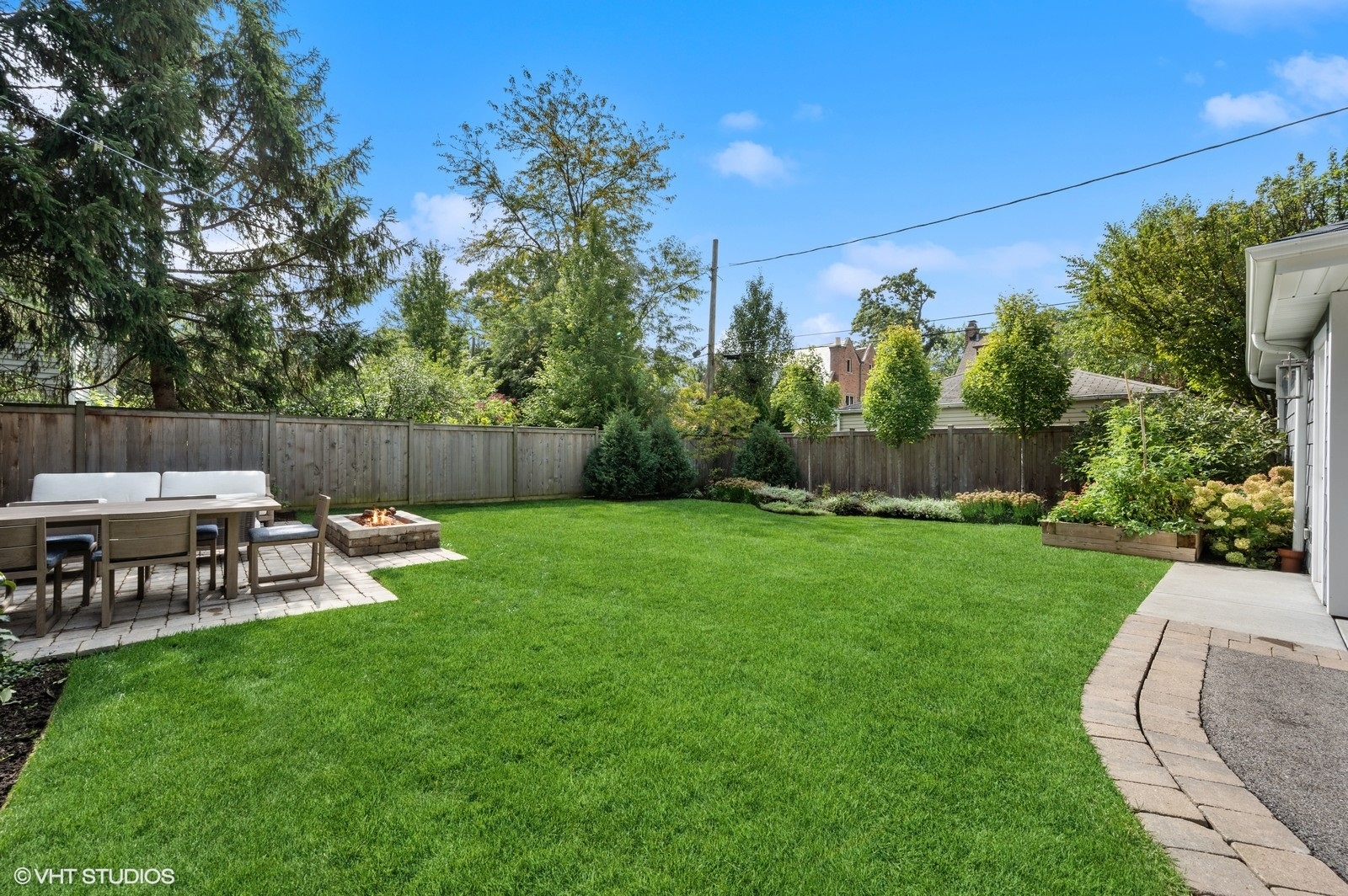 786 Locust Street Winnetka, IL 60093 - Photo 39 of 46 a view of a chair and table in the garden