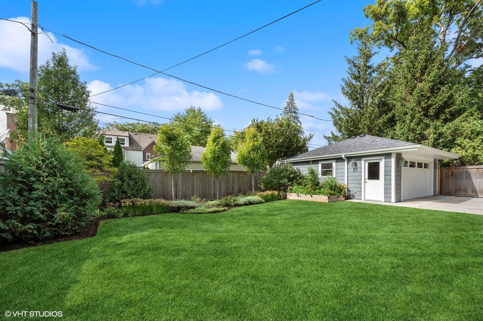 786 Locust Street Winnetka, IL 60093 - Photo 41 of 46 a view of a house with a yard and sitting area