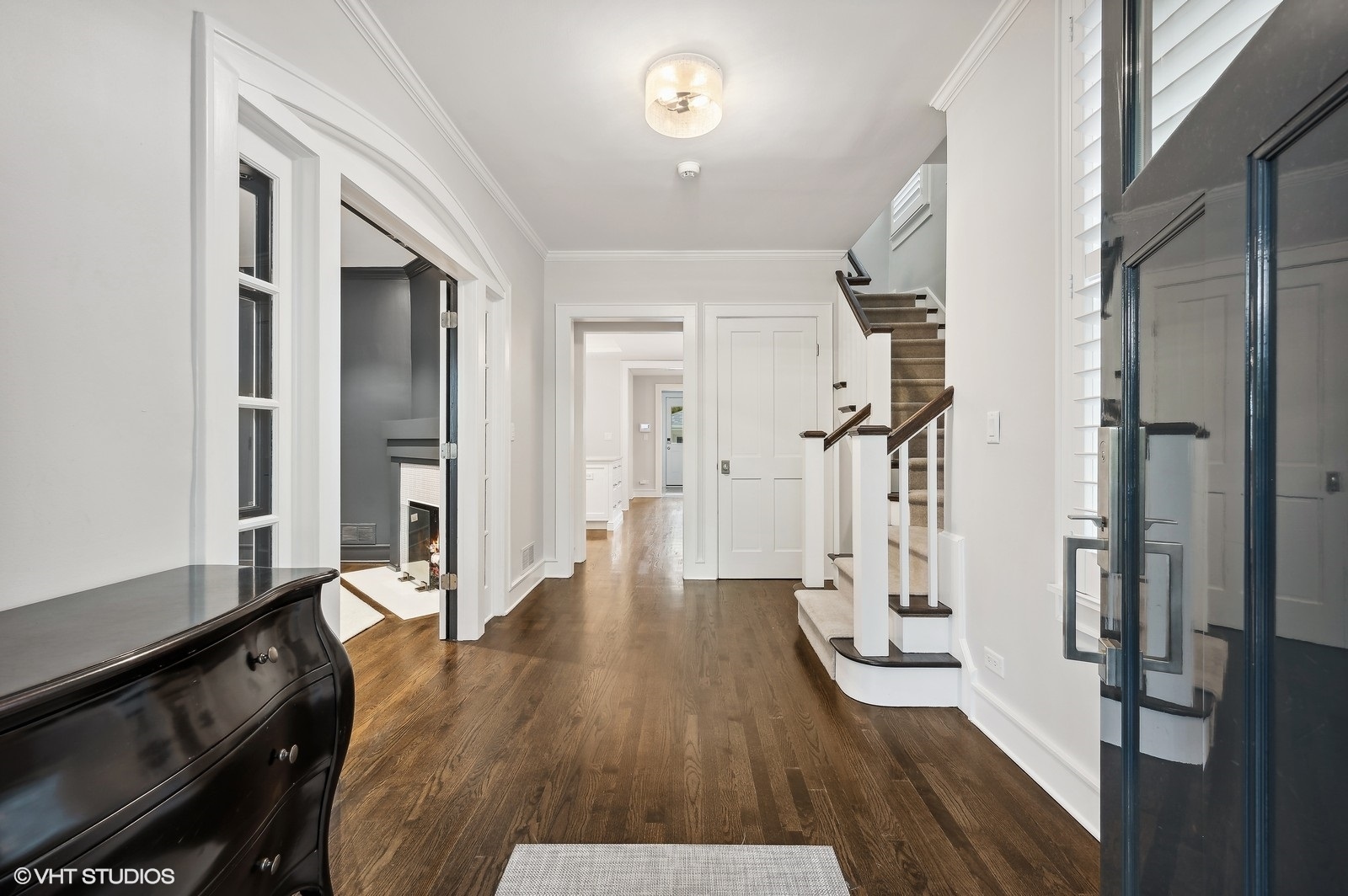 786 Locust Street Winnetka, IL 60093 - Photo 6 of 46 a view of a hallway with wooden floor and staircase