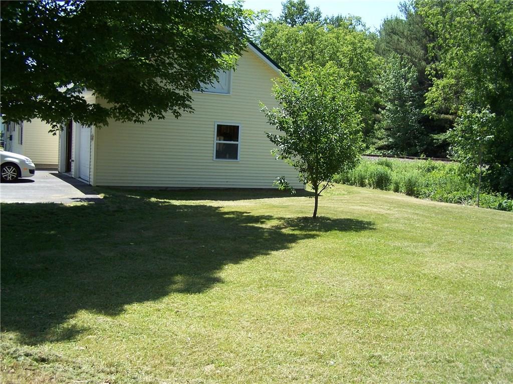 166 High Street Paris, ME 04281 - Photo 4 of 20 Large yard to the right of the garage.
