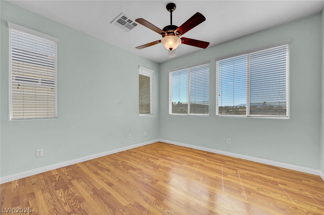 977 Sparkling Light Street Henderson, NV 89052 - Photo 55 of 75 This bright room features durable flooring, ample natural light, and a refreshing ceiling fan.