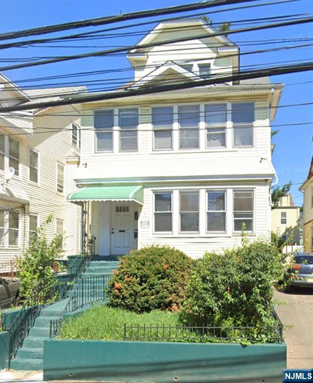 187 Shephard Avenue, Unit 1 Newark, NJ 07112 - Photo 1 of 18 a front view of a house with garden