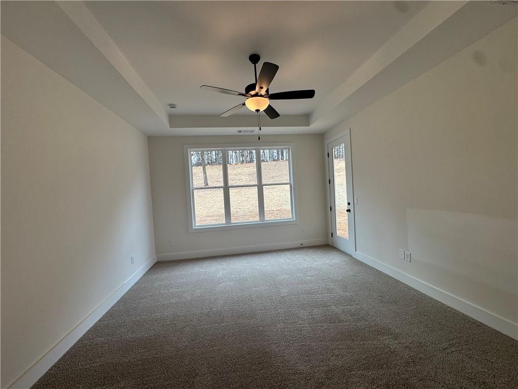1699 Darby Road Waleska, GA 30183 - Photo 10 of 17 an empty room with a window and a ceiling fan