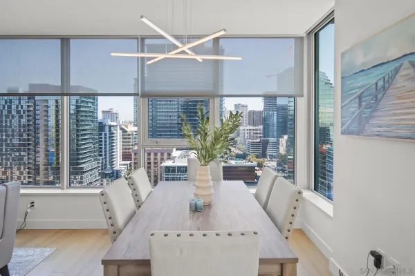 a view of a dining room with furniture window and wooden floor