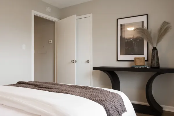 a bedroom with bed and window