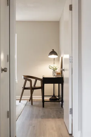 a view of a livingroom with furniture and window
