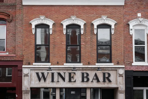 a front view of building with entrance