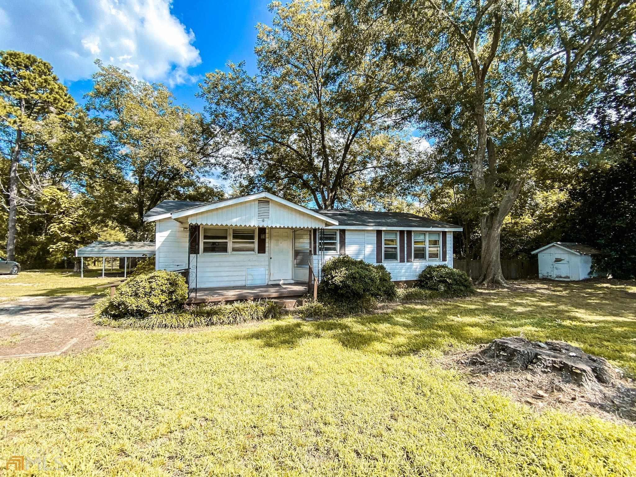 1114 Clacktown Road Winder, GA 30680 - Photo 1 of 1 a front view of house with yard and trees around